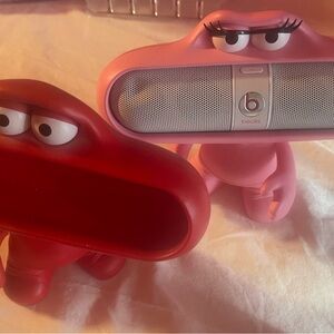 Beats Pill Speaker with Pink and Red Stands